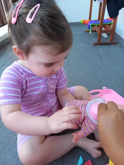A toddler playing with a toy