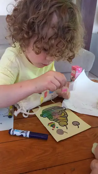 A child doing a craft activity