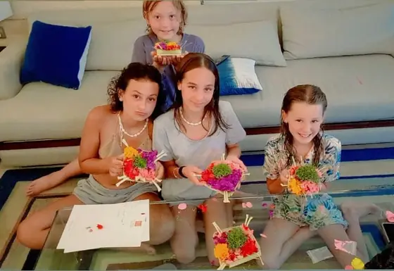 Children doing crafts together on the floor