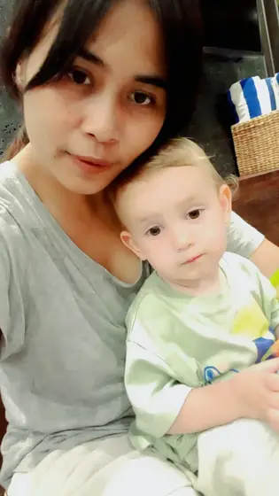 A nanny holding a baby
