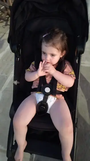 A baby sitting in a pram