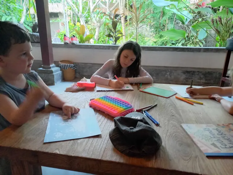 Children drawing and colouring at a table
